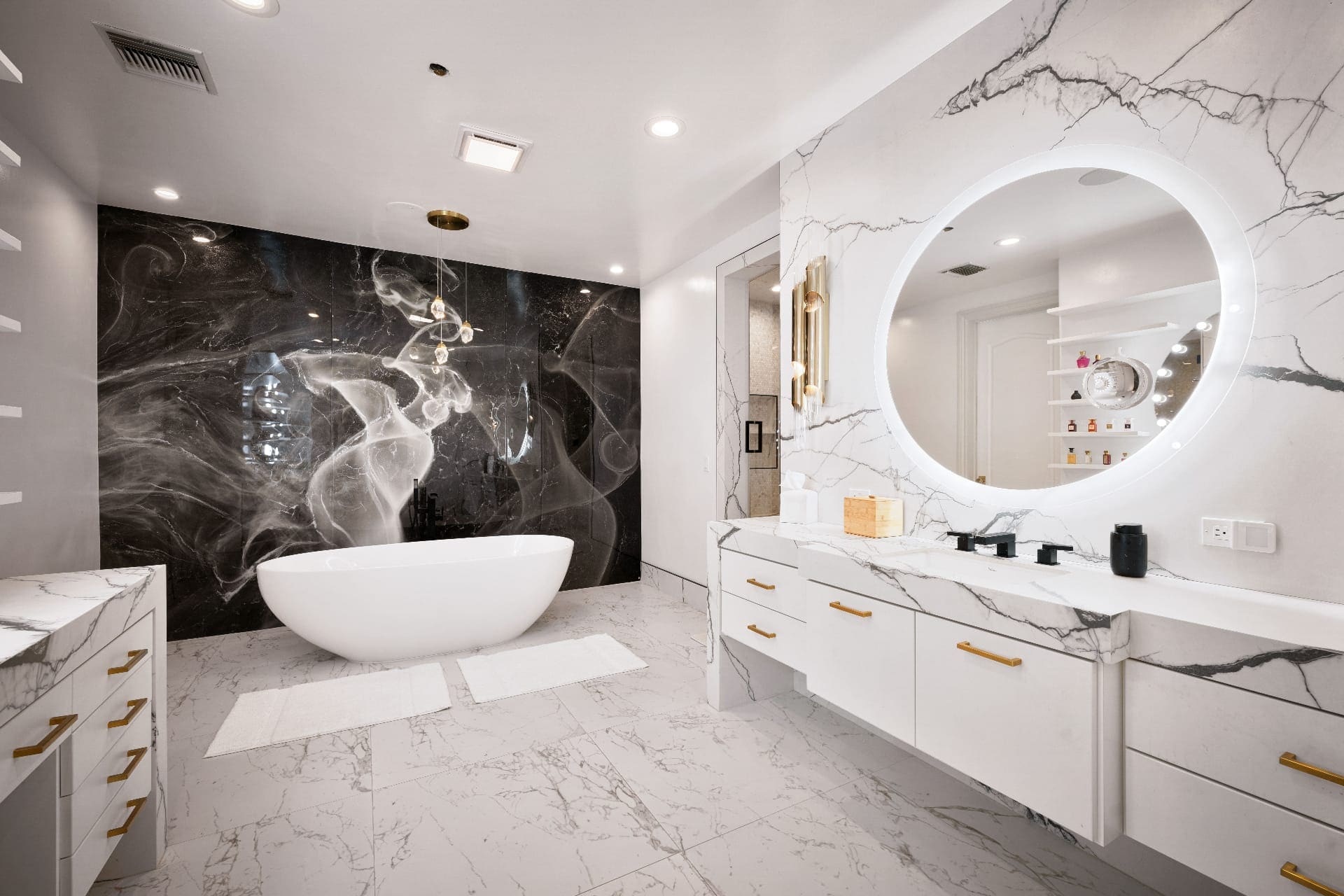 Bryn Mawr Master Bath in Bryn Mawr, PA — Luxury master bathroom renovation featuring dual vanities, frameless glass shower, and heated marble floors.